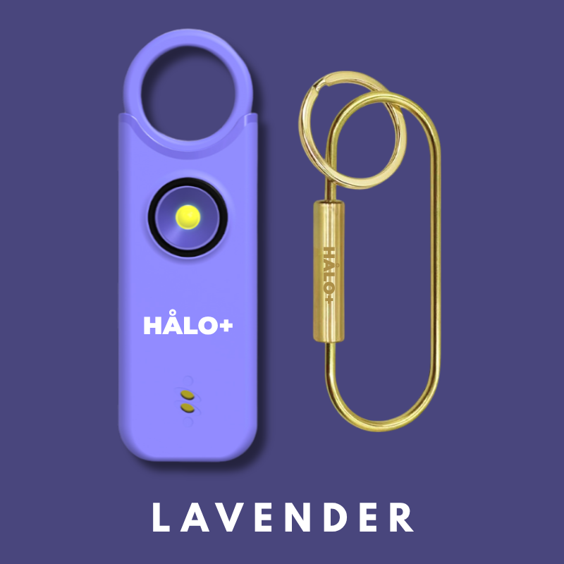 Lavender colored Personal Safety Alarm NZ with a gold keychain on a purple background, featuring the brand 'Halo+'.